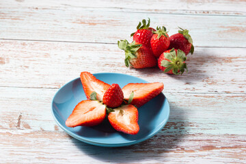 Strawberries at their peak: Ripe strawberries in a ceramic dish.