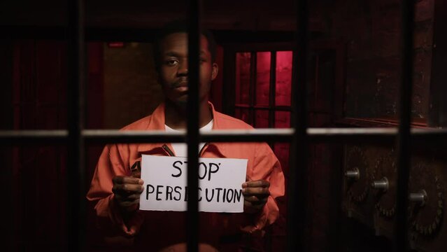 African american political prisioner in picket for stop persecution in jail.