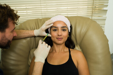 Hispanic woman getting plasma injections for a regenerative treatment - 778536060