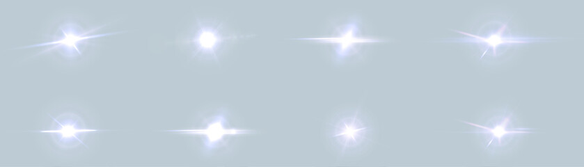 A set of bright light effects on a sky background. Vector