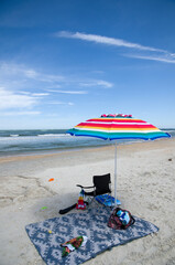 Colorful Beach Umbrella and Other Beach Objects with Blue Sky