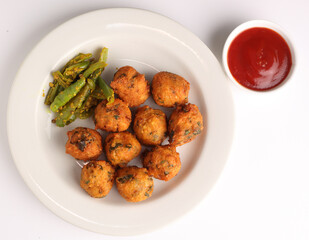 Title: Moong dal Methi Pakora is an Indian Snack served with Green mint chutney