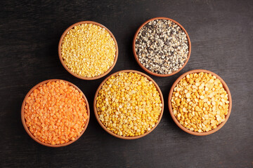 A bowl of mixed lentils that are widely used in India. Lentils are Red lentil, Mung bean, Black...