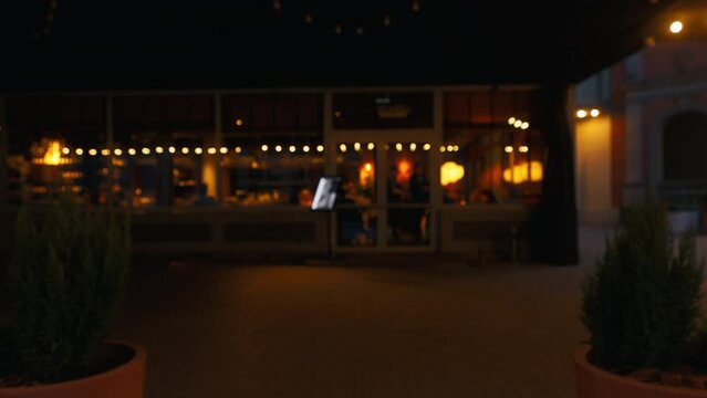 a blurry picture of a restaurant at night