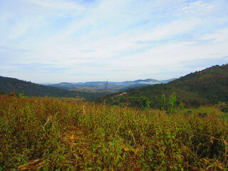 A beautiful landscape of mountains under mountains of a small country town