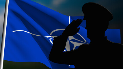 The silhouette of a soldier salutes the Nato flag