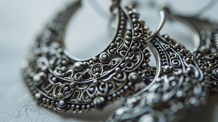 Chic Silver Filigree Earrings with Complex Floral Design on a Soft White Background