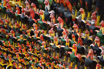 colorful rooster statue on a market stall