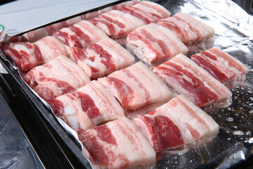 Pork belly that is cooked on a Korean-style grill
