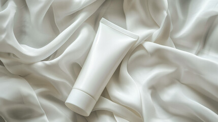 White cosmetic tube on white velvet clothing background
