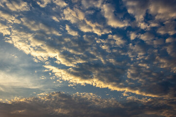 Clouds in the sky at sunset as a background. Texture.