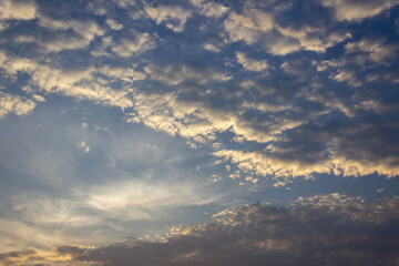 Clouds in the sky at sunset as a background. Texture.