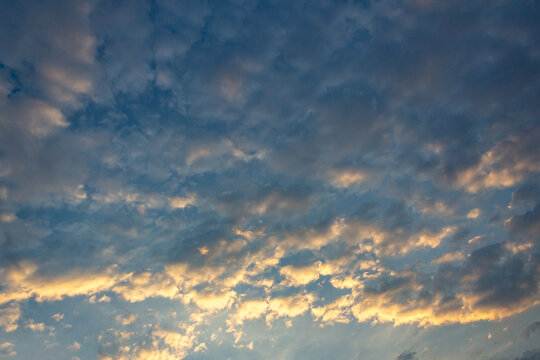 Clouds in the sky at sunset as a background. Texture.