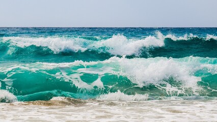 The rhythmic dance of the ocean's waves under the golden sun creates a mesmerizing spectacle, their...