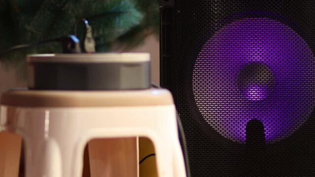 An hub for electric equipments, in the background the speaker changes colors