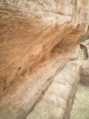 Old drain into the Al Siq gorge of Historical Reserve of Petra near the city of Wadi Musa which is...