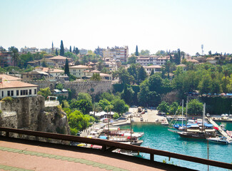 View from city wall to city port sailboats and tourist ships in the old city of Antalya in Turkey