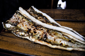 Delicious and healthy grilled eel cooked on an iron plate until yellow.