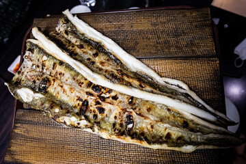 Delicious and healthy grilled eel cooked on an iron plate until yellow.