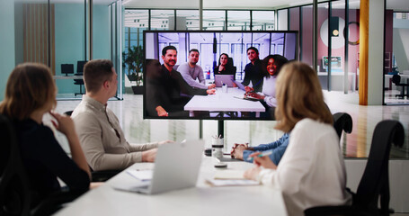 Group Of Businesspeople Having Video Conference