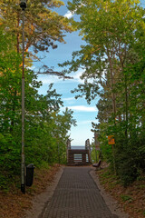 Wooden pier as an entrance to the beach