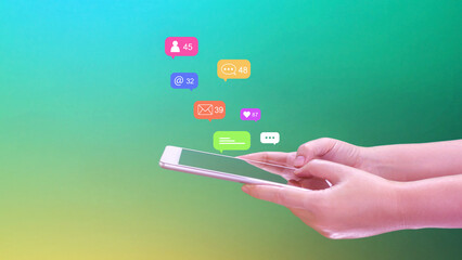People using social media and digital online marketing concepts on mobile phones with icons such as notifications, messages, comments on the smartphone screen.