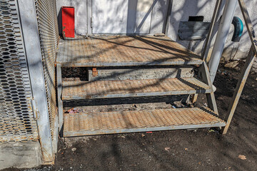 Metal porch steps on a spring day