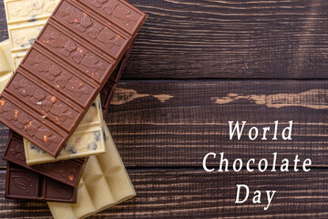 Chocolate bar pieces. Background with chocolate. Sweet food photo concept.