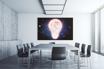 Creative light bulb illustration on tv display in a modern presentation room, future technology...