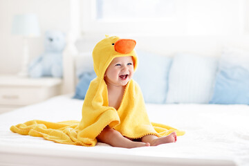 Cute baby after bath in yellow duck towel - 778676256