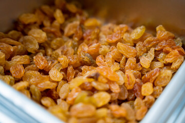 Nuts and dried fruits for making handmade chocolates and candies in a workshop