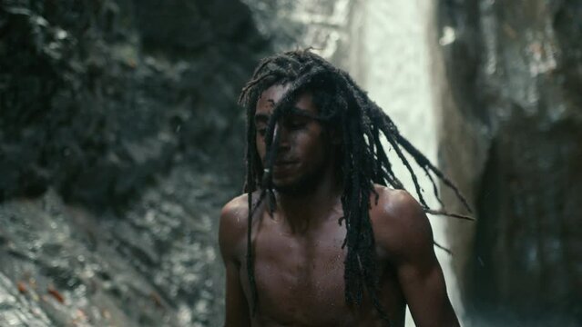 Rasta Man near Waterfall Bathing Stream