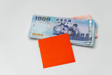 Adhesive note on Taiwanese dollar banknote