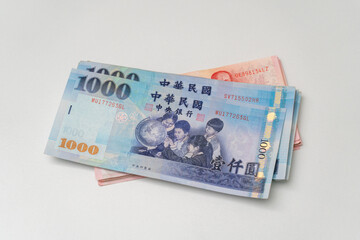 Taiwanese dollar banknote on white background - 778693423