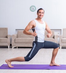 Young man training and exercising at home