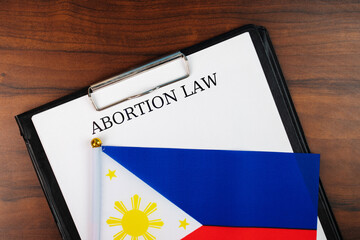 Abortion law in Philippines, Philippines flag background, debate over body autonomy, freedom of...