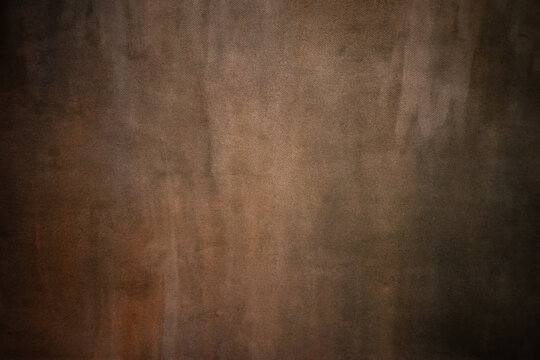 A photo of a vintage background texture for a portrait. Antique photo background.Brown texture.