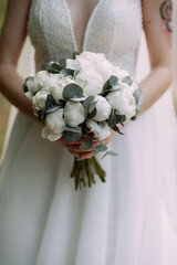 The image is of a person holding a bouquet of white flowers, likely a bride 6952.