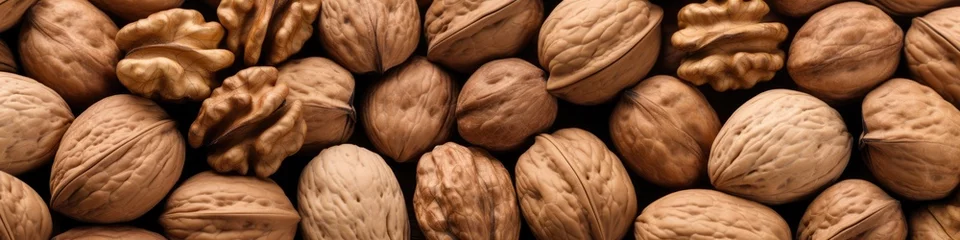 Fotobehang Fresh walnuts in a shell close-up. The background is made of nuts. © Cherkasova Alie