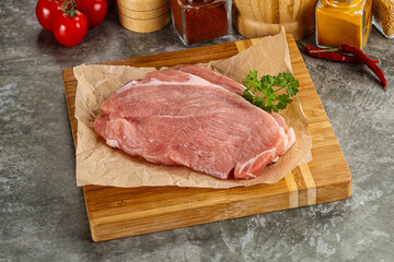 Raw pork schnitzel for cooking