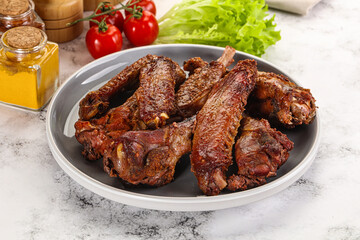 Roasted duck wings with sauce