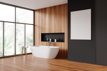 Fototapeta na wymiar Gray and wooden bathroom with tub and poster