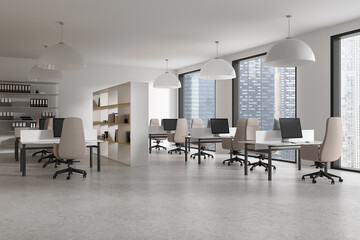 Modern office interior with desks, chairs, computers, and city view background, concept of a...