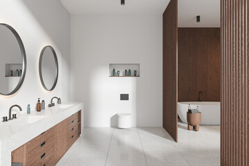 Modern wooden hotel bathroom interior with double sink, toilet and tub