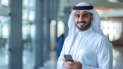 Muslim Businessman in White Traditional Suit Using Mobile Phone Inside Office Building. Generative AI.