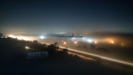 Mist. Nature. Fog. Pune. Maharashtra. India. view of a highway with vehicles and fog in midnight