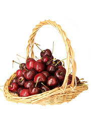 A basket of fresh fruit cherries on a white background