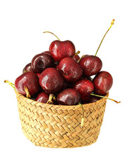 A basket of fresh fruit cherries on a white background