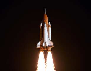 Nighttime Space Shuttle Launch Illuminating the Sky