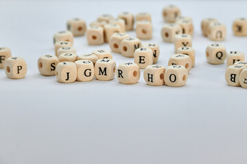 Scrambled letters on small wooden cubes